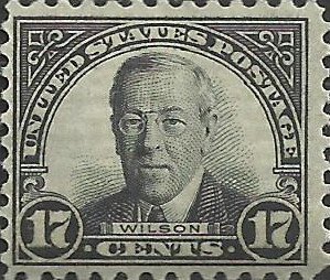 # 697 Mint Hinged Black Woodrow Wilson