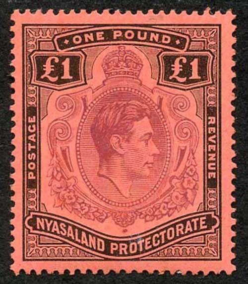 Nyasaland SG143 KGVI One Pound purple and black/red M/M
