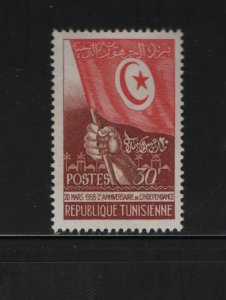 TUNISIA 319 Hinged, 1958 Hand Holding Flag, 2nd anniv. of Independence