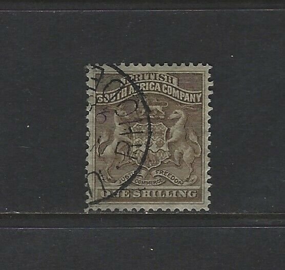 RHODESIA - #9 - 1SH COAT OF ARMS USED STAMP (1892)
