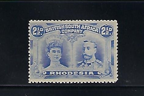 RHODESIA SCOTT #104 1910 DOUBLE HEAD 2 1/2D -DULL BLUE-PERF 14-MINT NEVER HINGED