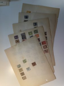 Collection of classic Japan stamps on old pages