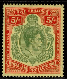 NYASALAND PROTECTORATE GVI SG141a, 5s green & red/pale yellow, LH MINT. Cat £80.