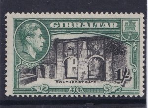 1938 GIBRALTAR - SG:127a - KING GEORGE VI - 1/- BLACK & GREEN P13.5 MOUNTED MINT 