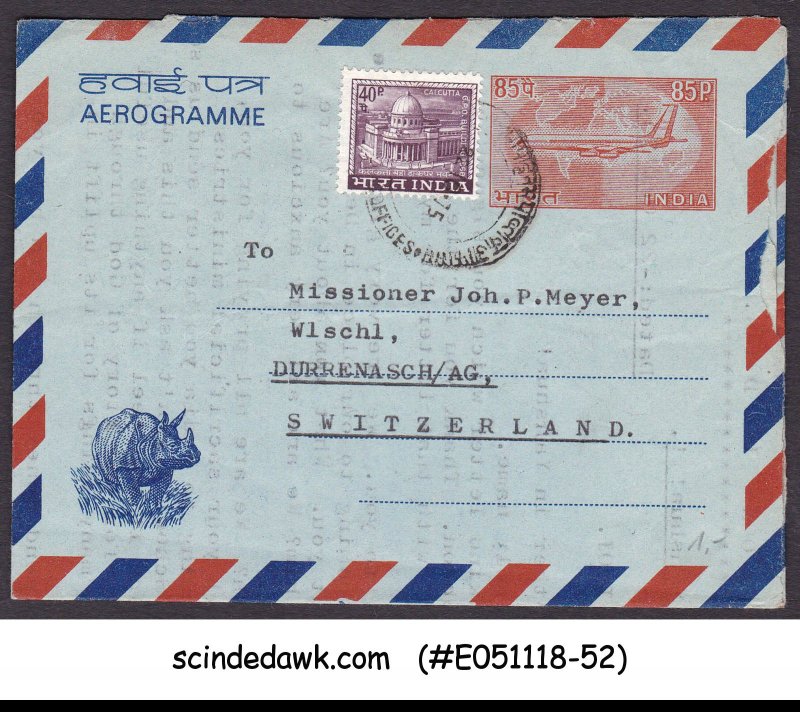 INDIA - 1975 AEROGRAMME TO SWITZERLAND UPRATED WITH STAMP