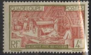 Guadeloupe 99 (mhr, gum skips) 4c sugar mill, yel grn & org brn (1928)