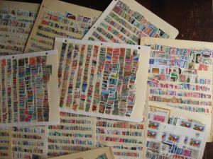 WW boxlot stamps haphazardly stuck into stock pages,no apparent order,what lurks