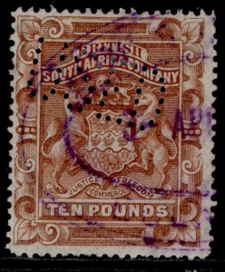 RHODESIA QV SG13, £10 brown, USED. PERFIN