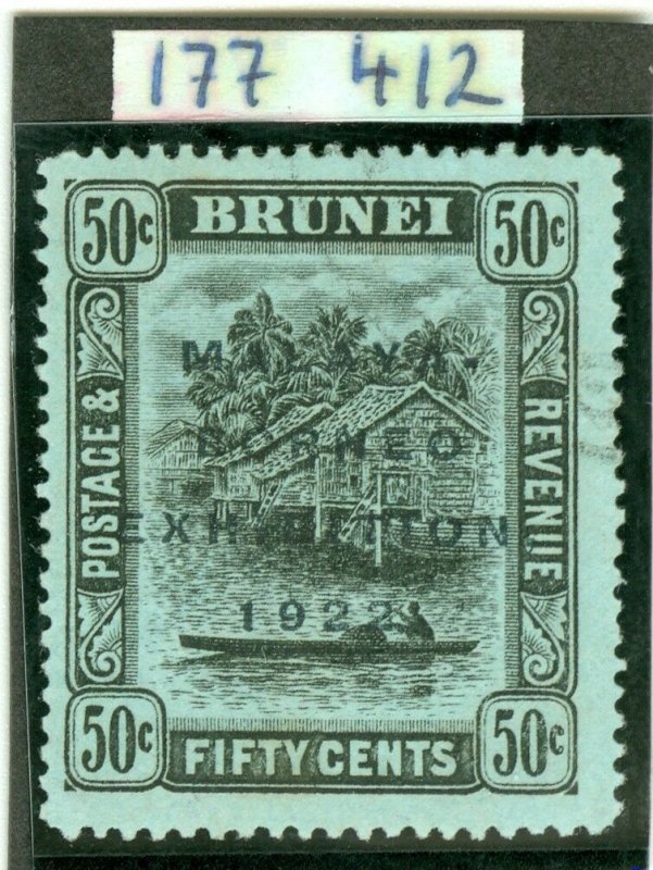 SG 58 Brunei 1922 50c black on blue green OVPT type 6. Very lightly used...