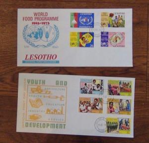 Lesotho FDC x 10 1973 1976 Red Cross Instruments UPU Bridges Food Siege Youth 