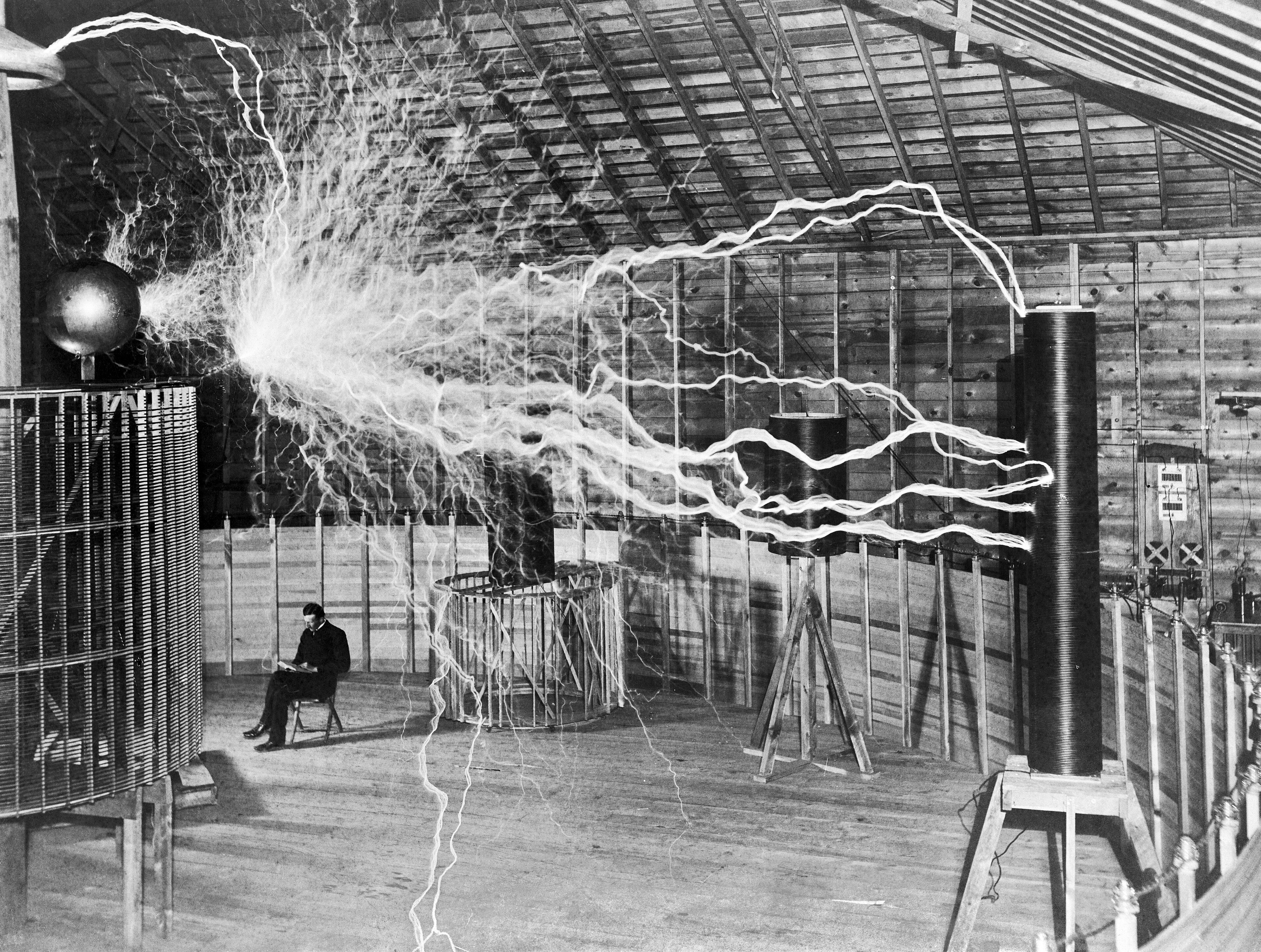 Nikola Tesla, with his equipment
