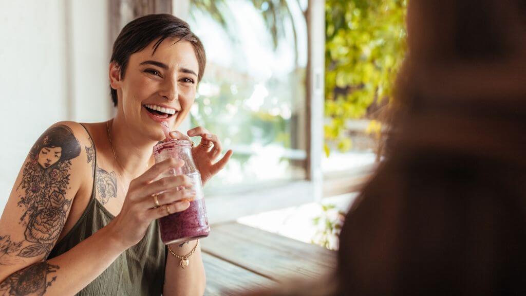 A woman enjoying a smoothie