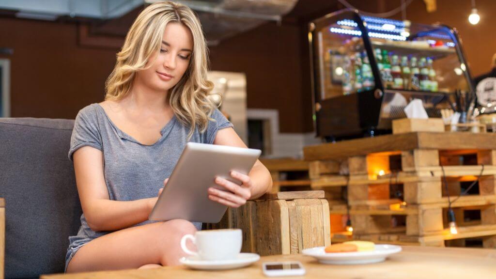 A woman using a smart tablet