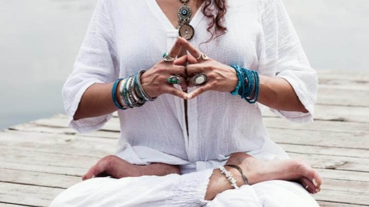 Woman meditating outdoors