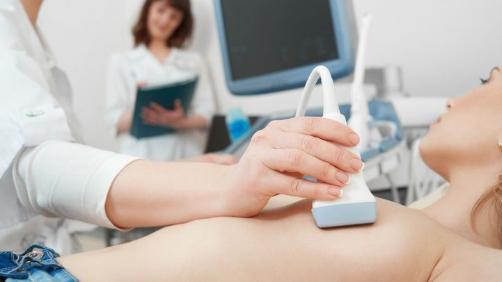 a woman having a mammogram