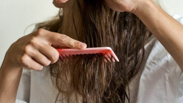 Woman brushing hair