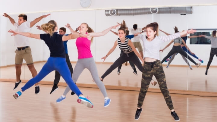 Teenagers exercising in a gym studio