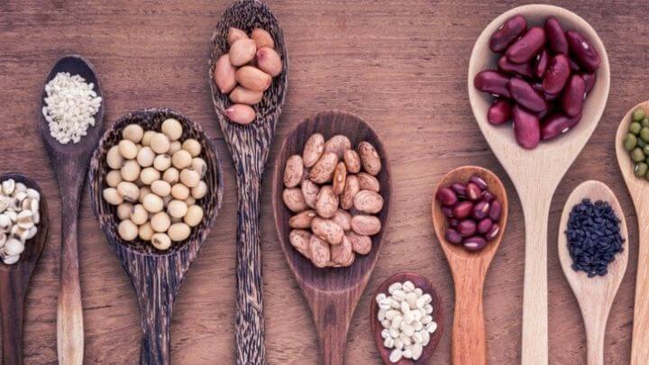 Wooden spoons with legumes