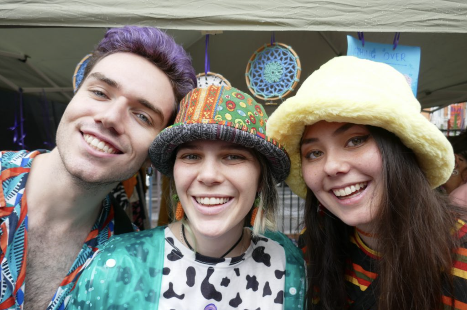3 people at a market stall