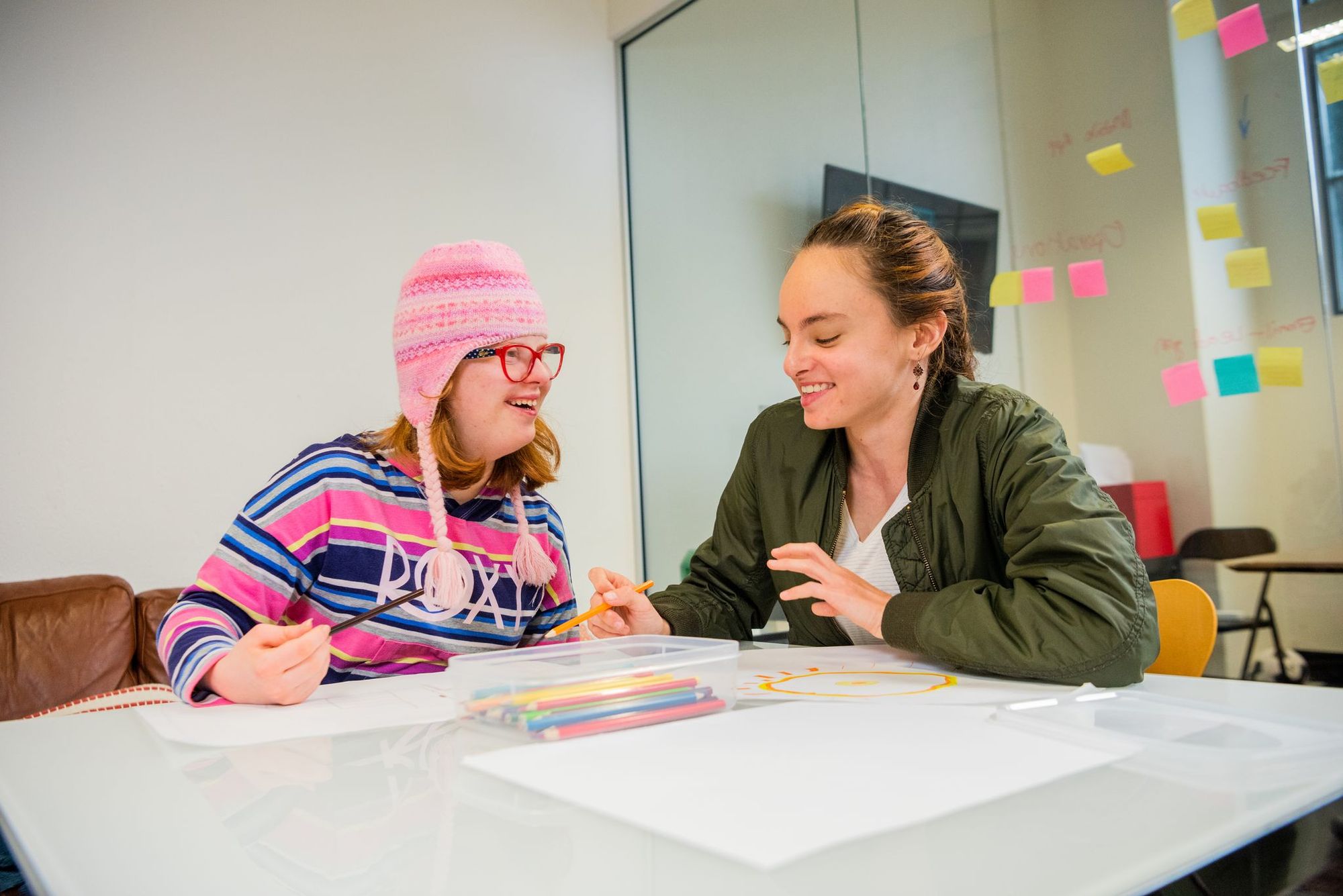 A Social Carer and a Member doing arts & craft