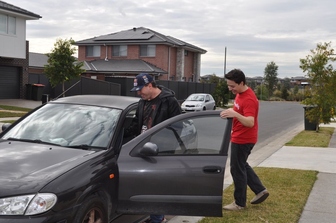 A Like Family Social Carer helping a Member get into a car