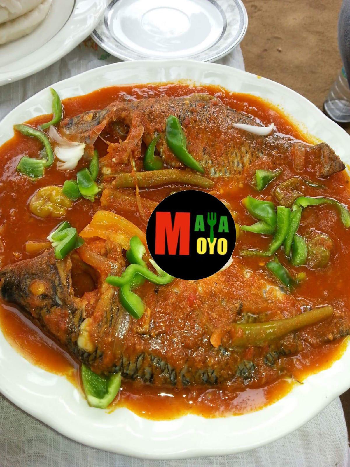 Two whole fish in rich tomato sauce