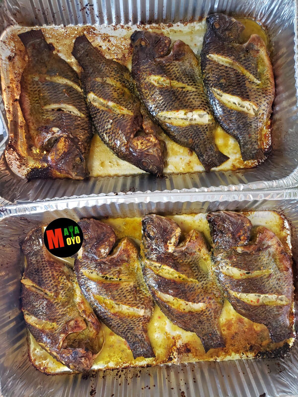 Two trays of grilled tilapia fish
