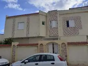 A vendre R+1: une villa+02appartements cité ERRIMEL GROMBALIA
