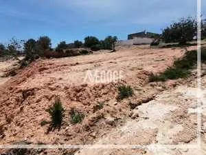  un terrain sur deux façades,à cité Rommen Mrezga à 1Km de la route principale