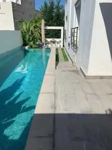 un appartement avec piscine et jardin aux Jardin de Carthage 