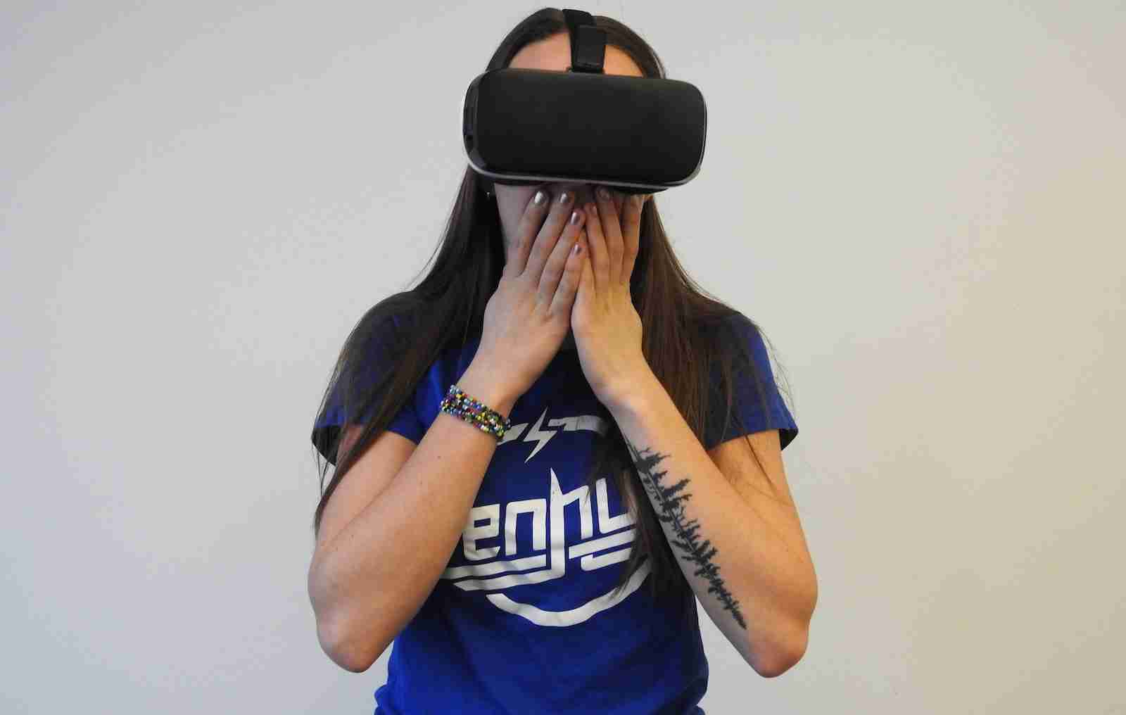 woman using black VR headset