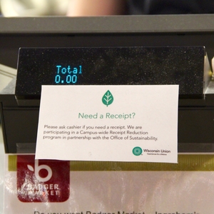 A sign posted on cash registers in Wisconsin Union restaurants, markets, and cafes tells customers about the receipt-optional initiative.