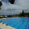 A heated, Olympic size, eight lane swimming pool affords a breathtaking view of the mountain, soccer field, Aghia Paraskevi, and city of Athens.