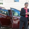 Amy Wildermuth, University of Utah's chief sustainability officer, with her electric vehicle purchased through the U Drive Electric program.