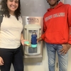 Queens College students using water bottle filling stations