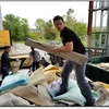 Student outreach assistant Conor Caneday teaches composting at local middle school