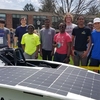 Principia College's competitive solar car team, with Earth Day enthusiasts.