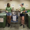 Weighing the Waste at UVM: first-year Environmental Studies major Elizabeth Mackin, sophomore Environmental Science major Lucy McGrew, and sophomore Environmental Studies major Alysa Kelly (from left), both to teach their peers what can be composted, and to learn what messages get results.