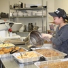 Student packaging food donations