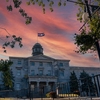 The Hiawatha Wampum Belt flag is raised over the McCall-MacBain Arts Building on McGill University's downtown campus.