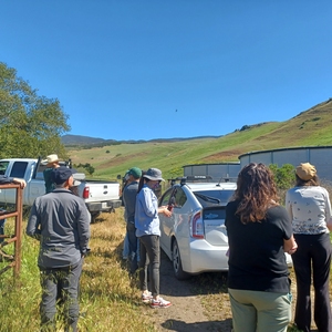 Cal Poly faculty visit the rain catchment facility in between FLC sessions to learn about sustainable cattle operations, land conservation, and how they can incorporate these opportunities into their classes as living labs.