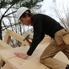 Renewable Energy & Ecological Design Major (REED) Adam Zais '16 building a Timber Frame bike shelter on campus.