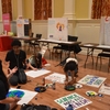 Students making posters for the March for Science and People's Climate March