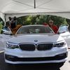 Peter the Anteater and a UC Irvine staff member visit the Pump2Plug EV Showcase.