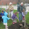 Roosevelt University (RU) plants a tree for their Arbor Day Observance. Kids, from the Bright Horizons Daycare (located on RU's Schaumburg Campus), and RU tradesmen, staff, students, and RU's arborist participated. 