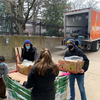 Volunteers at the MBC unloading donations from the Food Gatherers truck.