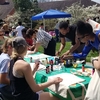 Principia College students paint reusable canvas totes at Earth Day!