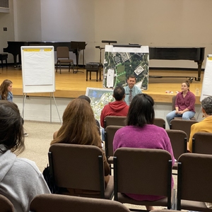 Participants and facilitators from the Greenspace Town Hall interact.