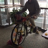 Mark Welch '17 President of Environmental Action Club blends up smoothies using Wheely Good Smoothie's pedal power blender bike at Evergreen Fest: Science and Climate Change Festival