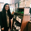 Student Donating to Charity by Declining a Plastic Bag at the Bookstore